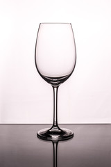 Silhouette of a glass on a white background stands on a glass