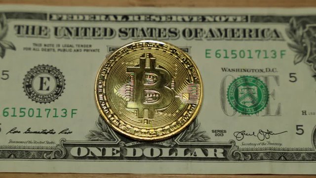 Bitcoins and dollar. US dollar and bitcoin coin.