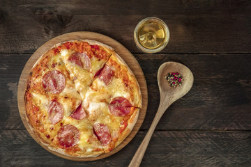 Pepperoni pizza with white wine, peppercorns, and copyspace