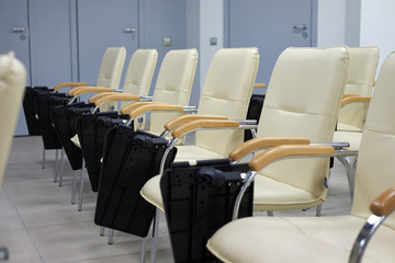 background of empty row of white chairs in the conference hall.