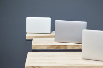 several laptops on the tables