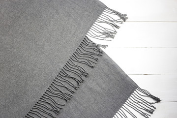 Background texture of a gray winter fashionable female scarf