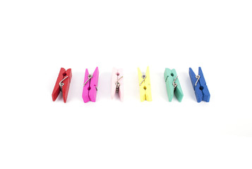 multicolor cloth wooden clamp on white background