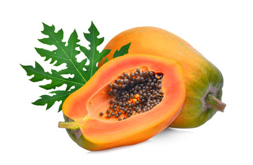 whole and half ripe papaya with green leaf isolated on white background