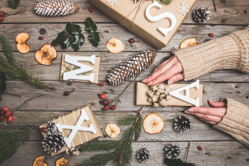 Fototapeta premium New Year composition on a wooden table. Christmas background. Flat lay.Top view