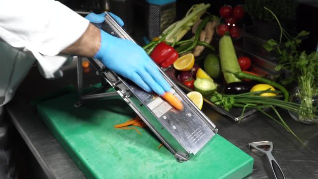 cutting vegetables - the chef cuts vegetables with a cutting knife.