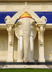 White elephant statue standing in front of the building