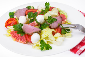 fresh vegetable salad with ham and mozzarella
