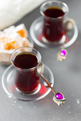 Red tea in turkish glasses on a wooden table