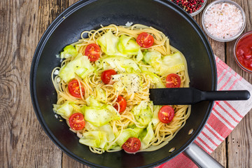 Frying pan wok with spaghetti with vegetables