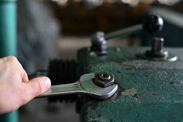 worker press start button on panel control for start CNC machine