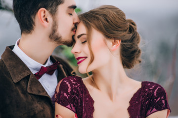 walk the groom and the bride in the Carpathian mountains