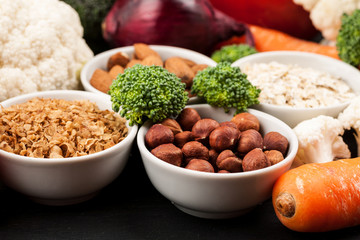 Fresh raw vegetables with nuts and cereals for cooking or eating. Vegetarian food.
