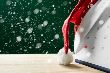 christmas background,calendar mark on the 25 of December on wood table with snow