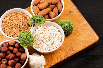 Fresh raw vegetables with nuts and cereals for cooking or eating. Vegetarian food. Top view