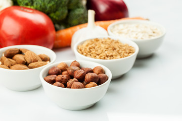 Fresh raw vegetables with nuts and cereals for cooking or eating. Vegetarian food.