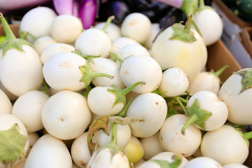 Close up of small White eggplants at the farmers market