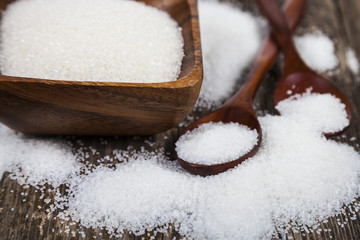 Bowl with sugar and a wooden spoons