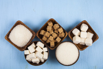 Five bowls of sugar, top view