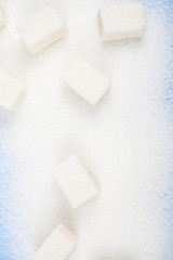 White sugar and cubes of sugar
