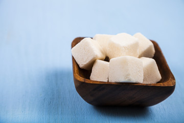 Sugar in a wooden bowl