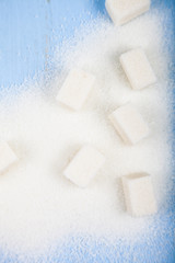 White sugar and cubes of sugar