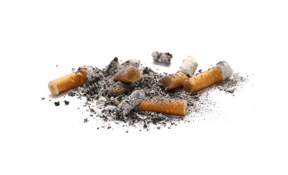 Cigarette stubs and ash isolated on white background