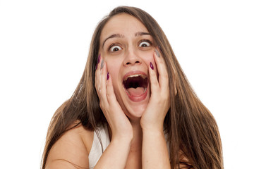young woman laughs euphoric on white background