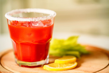 Bloody Mary alcoholic drink with lemon and celery