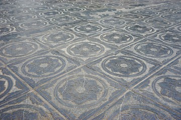 Ancient carved stone tile floor in Hanoi, Vietnam