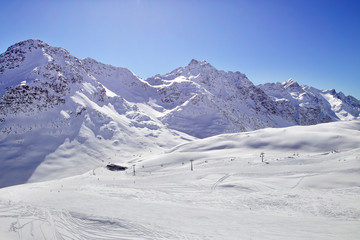 Fototapeta na wymiar Winter mountains, panorama - snow-capped peaks of the Italian Alps