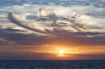 Naklejka na ściany i meble Beautiful sunrise in the ocean.