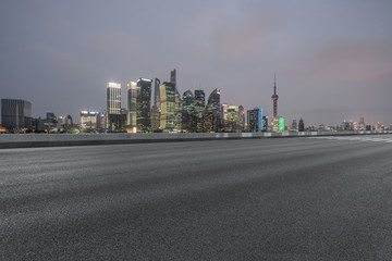 Empty asphalt road through modern city in Shanghai, China