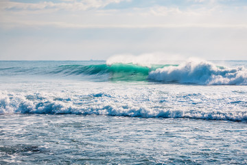 Obraz na płótnie Canvas Wave crashing in ocean. Crystal wave in Bali