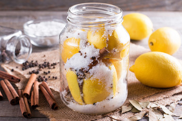 Salted lemon on wooden table