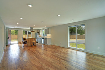 Fototapeta na wymiar Open floor plan interior features a newly remodeled kitchen