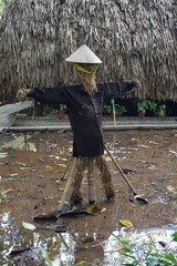 Rustic garden scarecrow in rural Vietnam