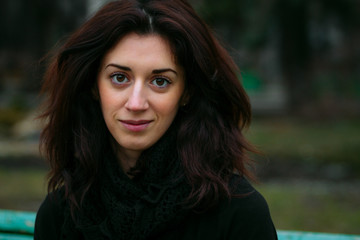 Portrait of a beautiful young girl in park.