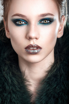 Beauty face. Beautiful model girl with the beautiful makeup. The green tones. Beautiful young woman.sensual model girl with beautiful green eyes. fashion portrait