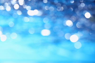 Blue abstract sky background with glitter and bokeh pattern