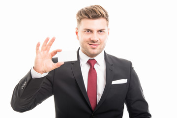 Handsome manager showing blank business card