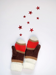 knitted mittens isolated on white background with stars