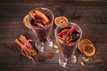 Mulled wine with fruits, cinnamon sticks, anise and decorations