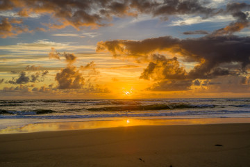 Fototapeta na wymiar HDR Sunrise in the beach in Bahia