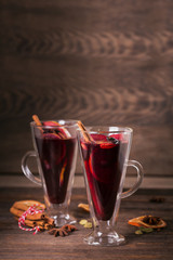 Mulled wine with fruits, cinnamon sticks, anise and decorations