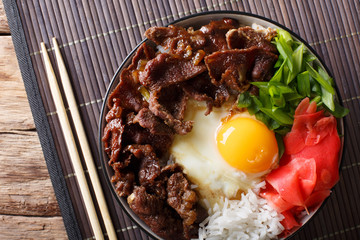 Japanese Beef Rice Bowl, Gyudon close-up on the table. horizontal top view