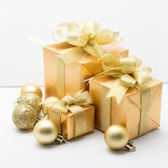 Fototapeta na wymiar Golden gift box for christmas days and new year days