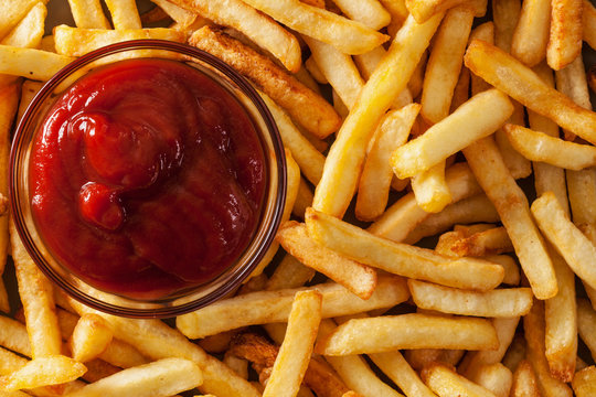 Delicious french fries and ketchup - top view