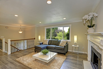 Second floor landing living space with a white fireplace