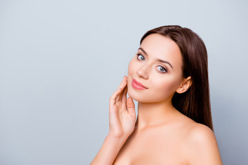 Portrait with copy space of young woman  showing her perfect, clean, fresh skin after bathroom. Cosmetology, beauty and spa